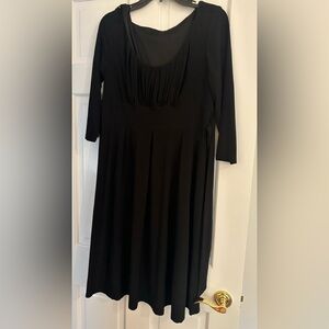 Black jersey dress with belt.